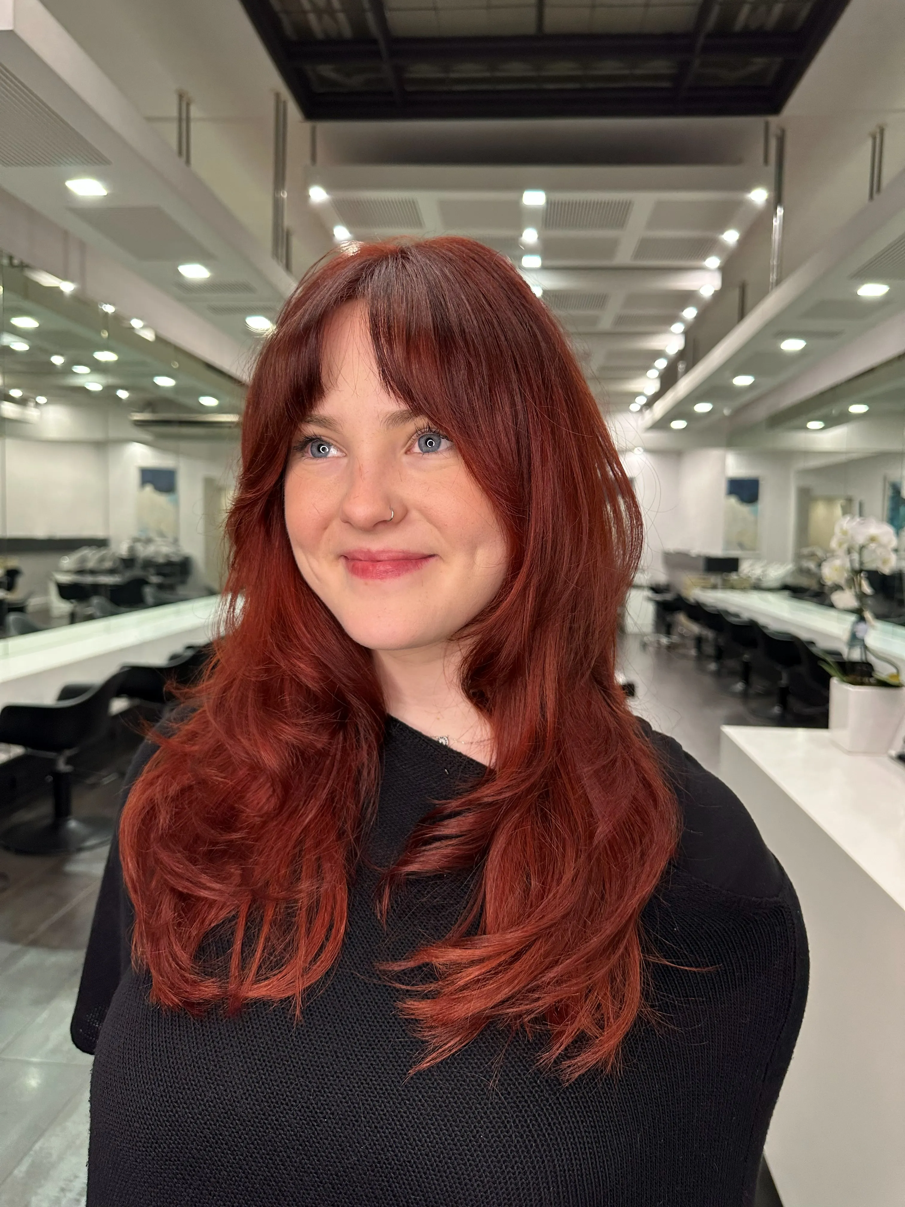 Rich auburn red colour transformation with a curtain fringe at Salon Ayre Mentone