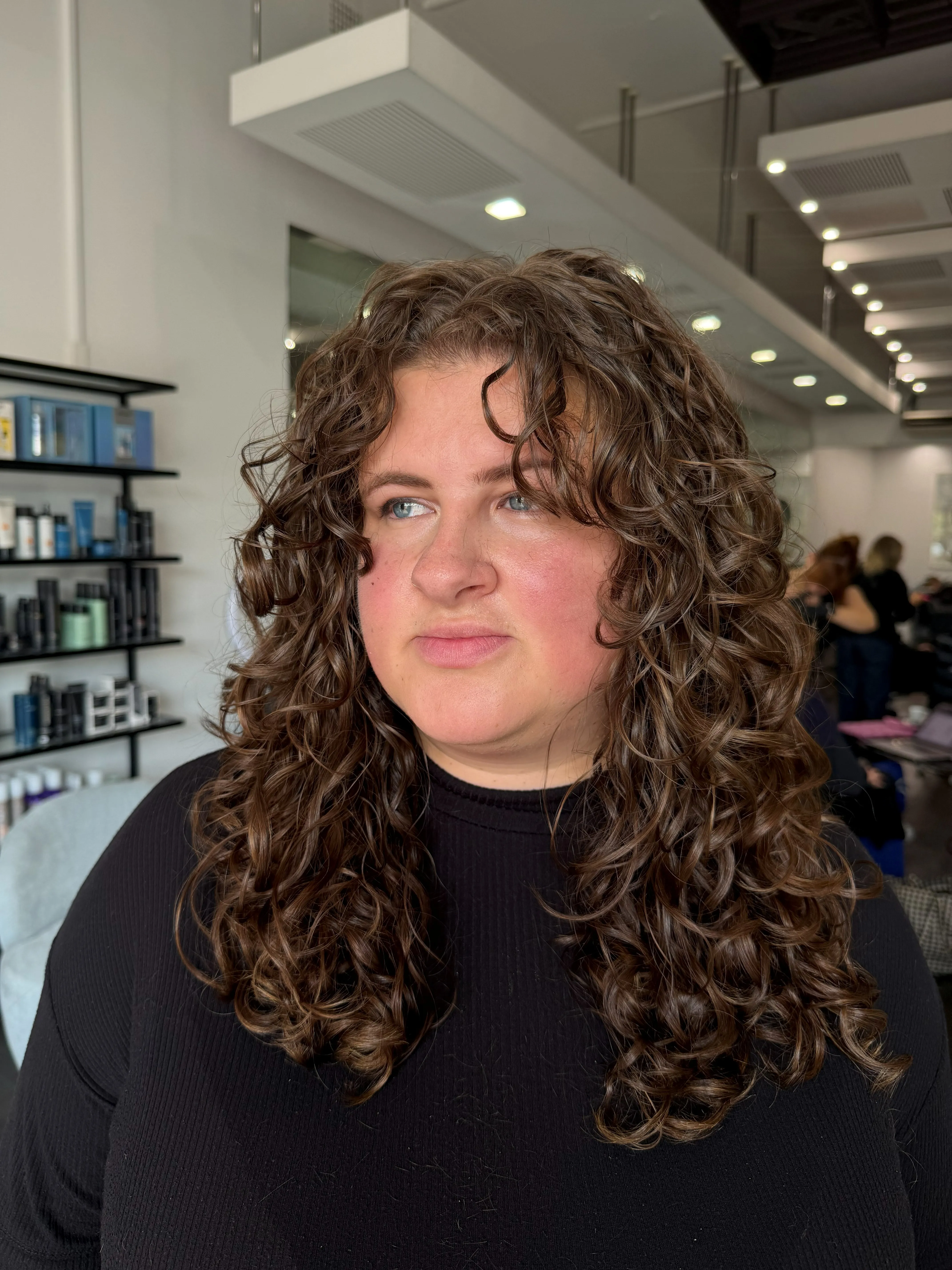 Defined natural curls after a curly cut at Salon Ayre Mentone